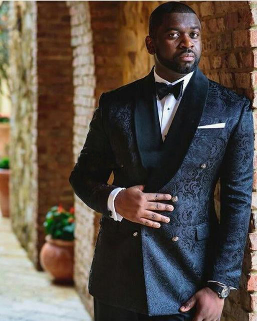 Men's black tuxedo with bow tie, patterned vest, and matching jacket