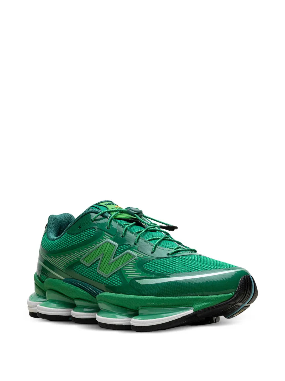 Green lace-up low-top sneakers with large N logo and cushioned sole