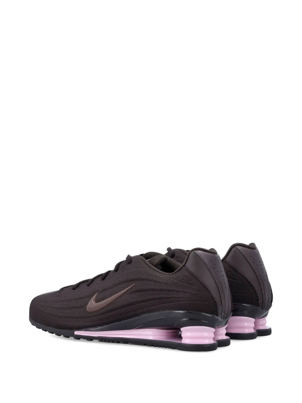 Dark brown Nike trainers, rear side view with Swoosh and purple-tinted sole