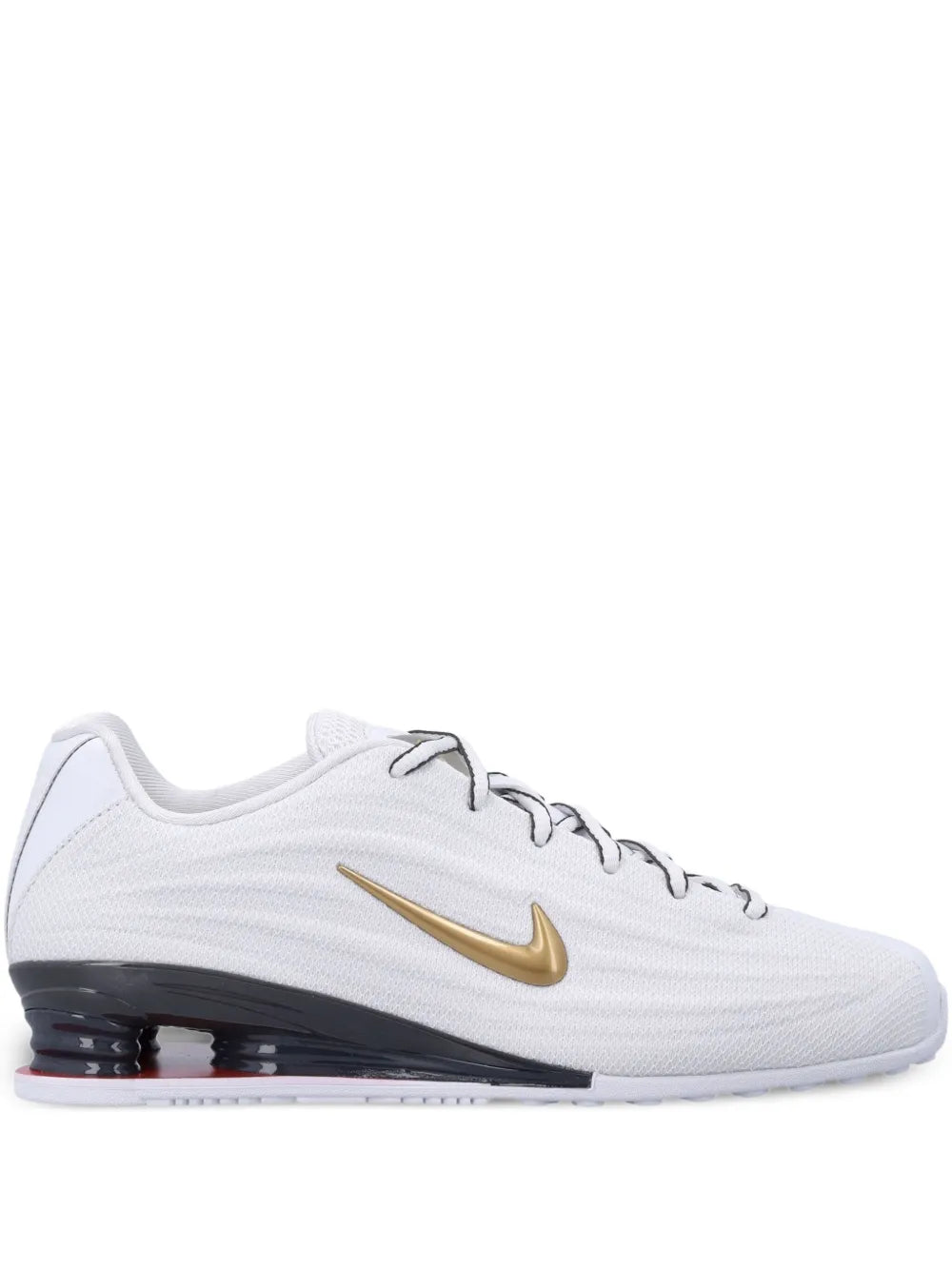 White lace-up trainers with gold swoosh and dark outsole with air pods