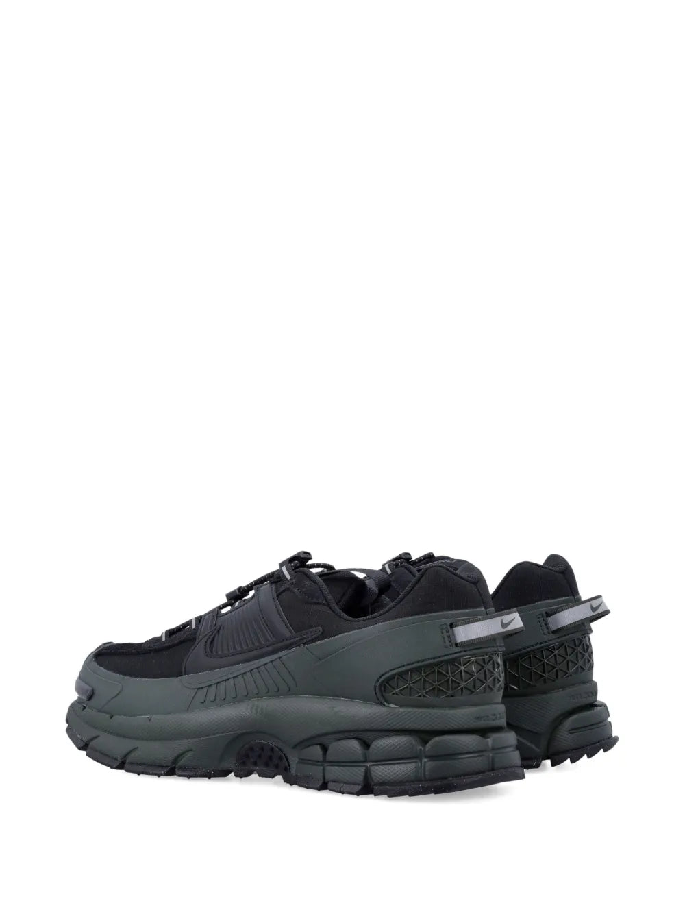 Zoom Vomero trainers in black with thick sole, side logo panels, and dark green accents