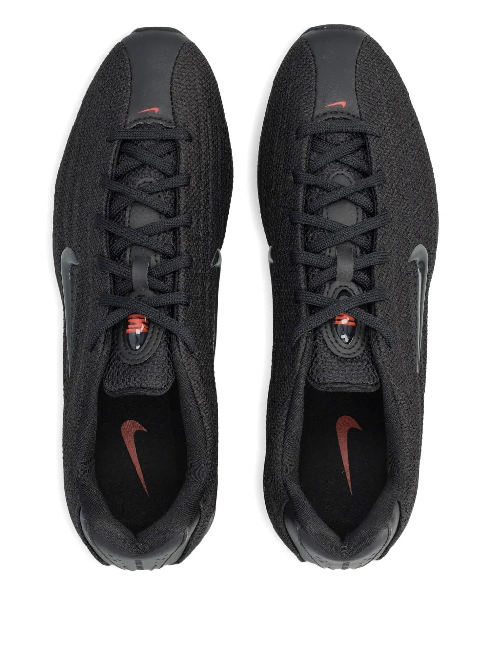 Black Nike Shox Z trainers with lace-up uppers and red logo accents