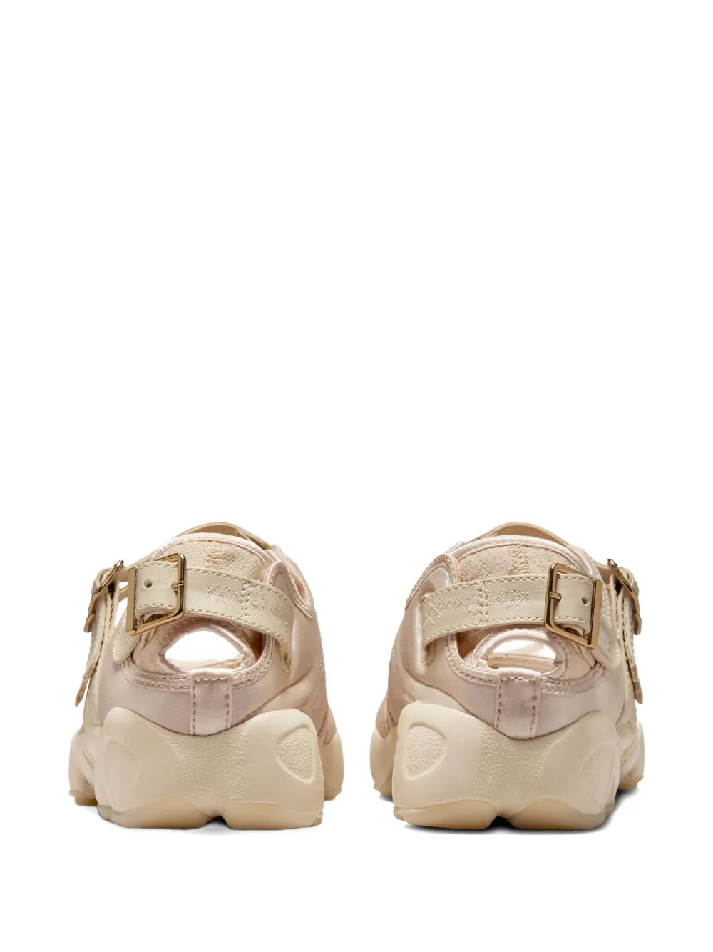 Beige sneakers with heel straps and adjustable buckle details, rear view