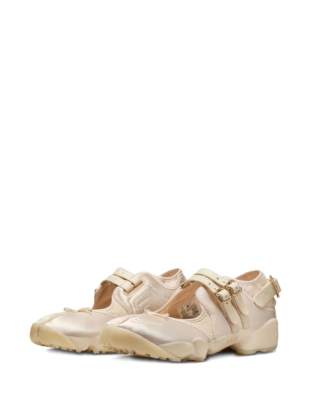Beige sneakers with three strap buckles, side view