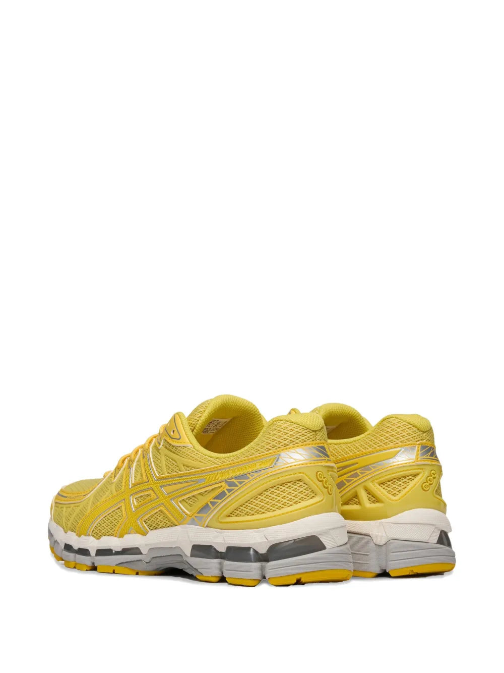 Yellow running shoe rear view with thick cushioned sole and mesh upper