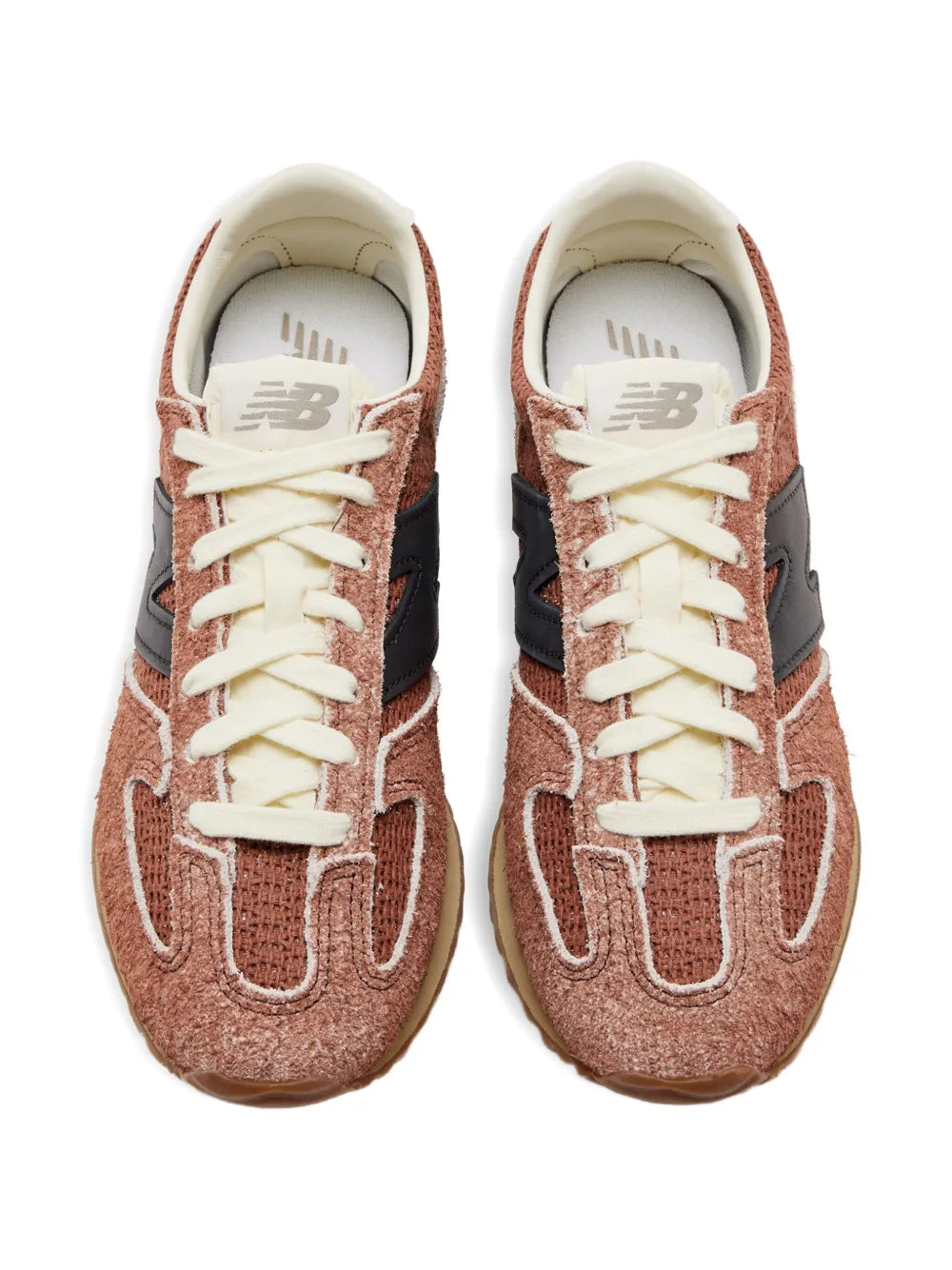 Pair of brown New Balance suede sneakers with off-white laces and black side panels