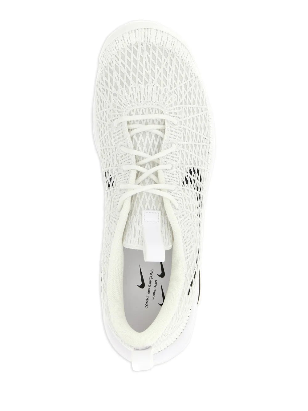White knit sneaker with white laces and Nike logo patch on inner side