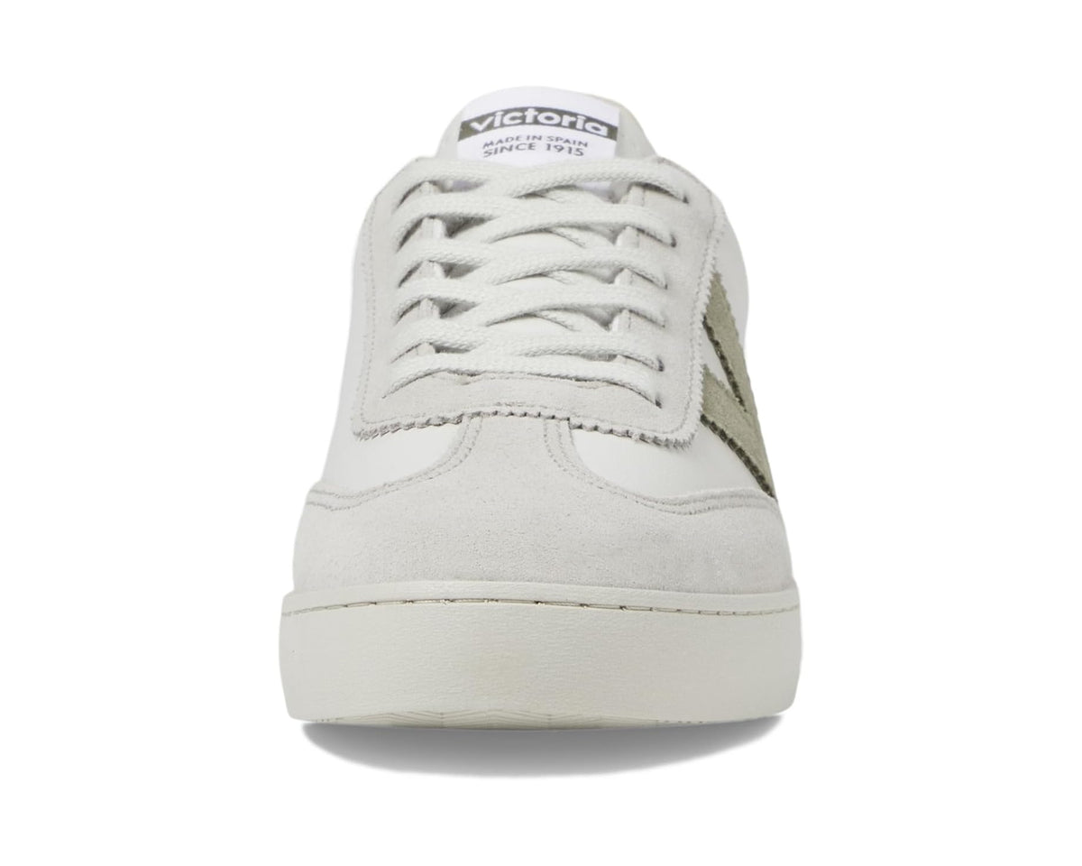 White low-top sneaker front view with lace-up rows and side logo detail