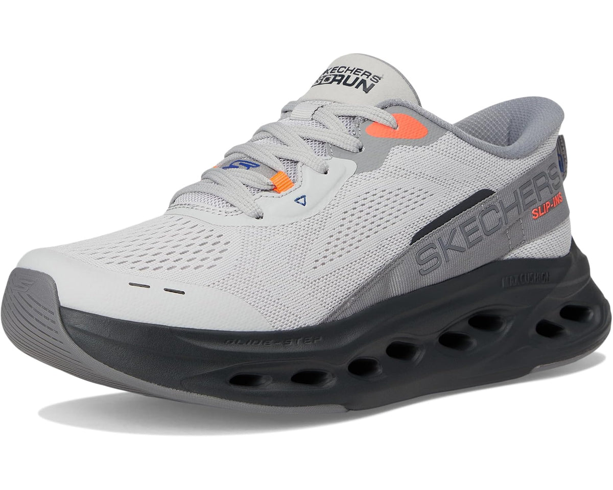 Men's gray slip-on sneaker with black outsole pods and orange heel accent