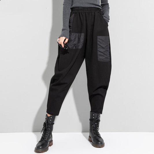 Women's black cropped pants with elastic waist and roomy relaxed fit