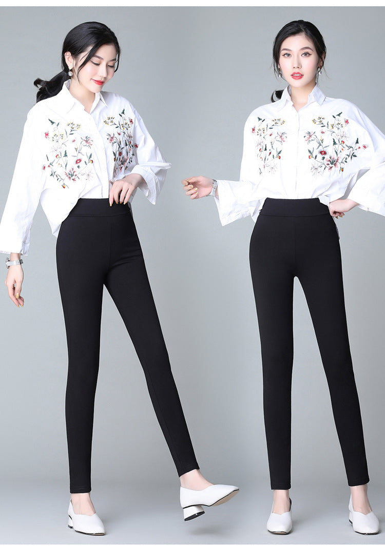Black casual pants with white side stripe, front view showing full length