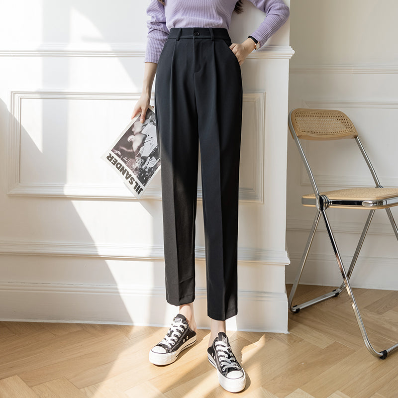 Black high-waist wide-leg trousers with pleats and belt loops