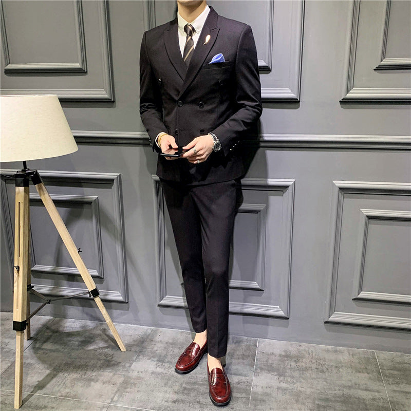 Black double-breasted suit jacket and matching trousers, button front and chest pocket