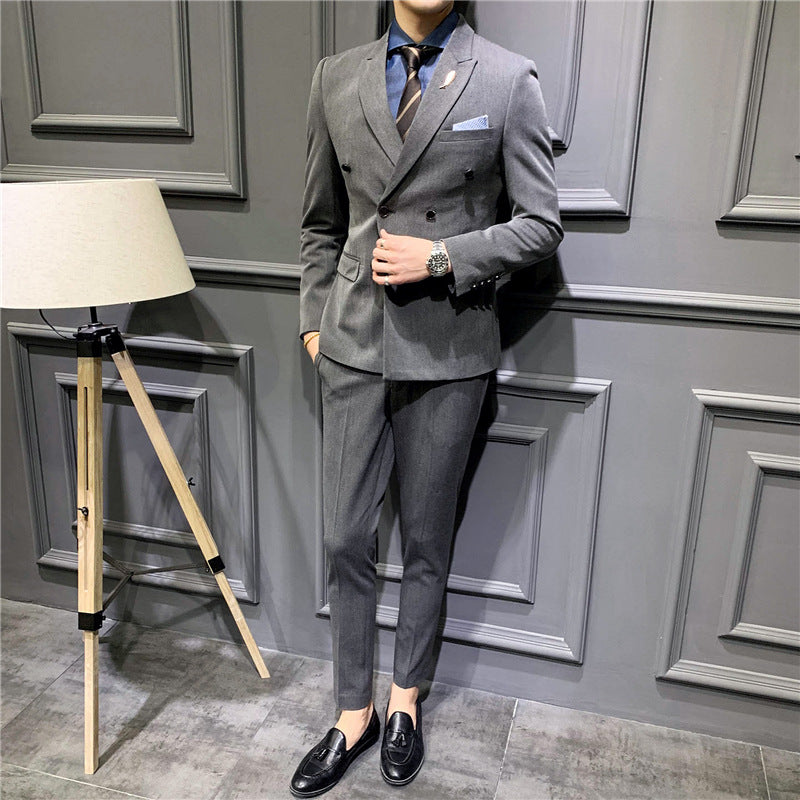 Gray double-breasted suit jacket and matching trousers, pocket square and lapels