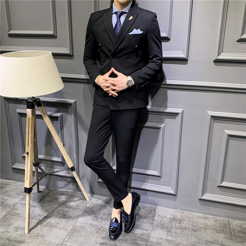 Black double-breasted suit jacket and matching trousers, pocket square and lapels