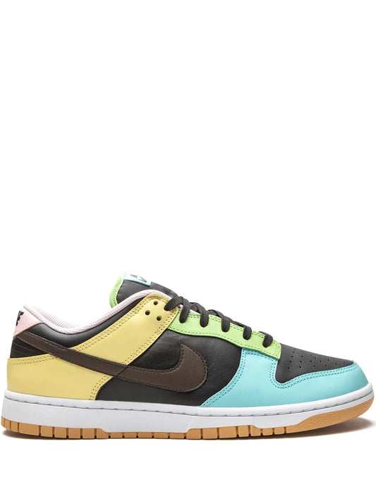 Nike Dunk Low SE sneakers with yellow, black, blue, and green panels