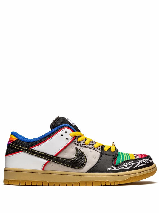Nike SB Dunk Low low-top skate shoe in white/black with colorful laces and gum sole