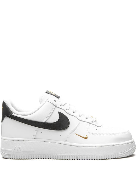 Nike Air Force 1 Low Essential sneakers, white leather with black swoosh and gold accents