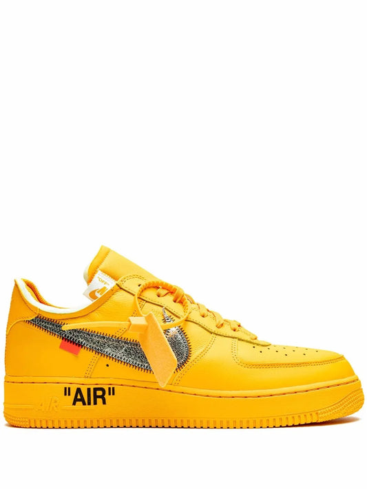 Yellow low-top sneakers with Nike swoosh and 'AIR' text on side