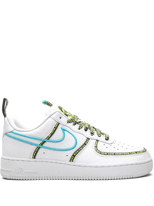 White Nike Air Force 1 sneakers with blue swoosh and green text detailing