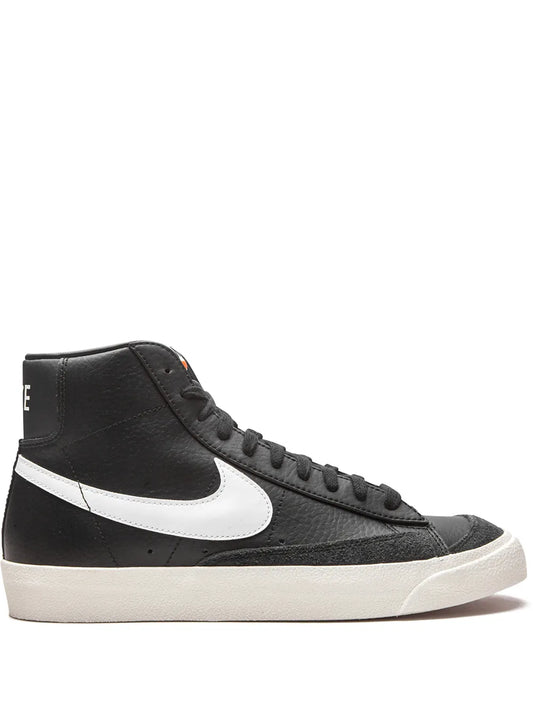 Black mid-top Nike Blazer sneaker with white swoosh and lace-up design