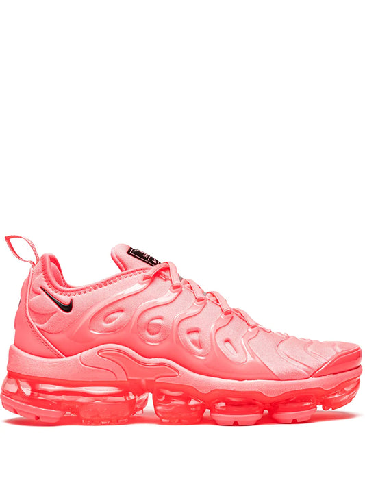 Nike Air Vapormax Plus running shoes in bright pink with black logo and lace-up design