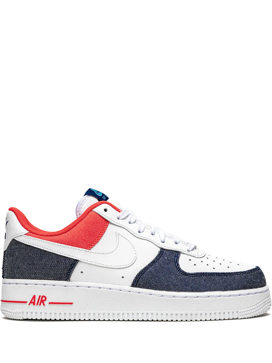 Low-top sneaker with white leather, navy panels, red collar, Air branding, lace-up