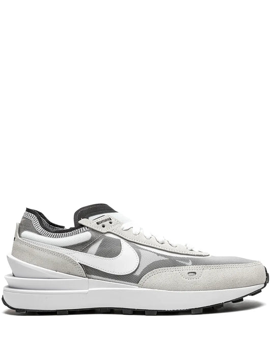White and gray Nike running sneakers with lace-up, swoosh logo, chunky sole
