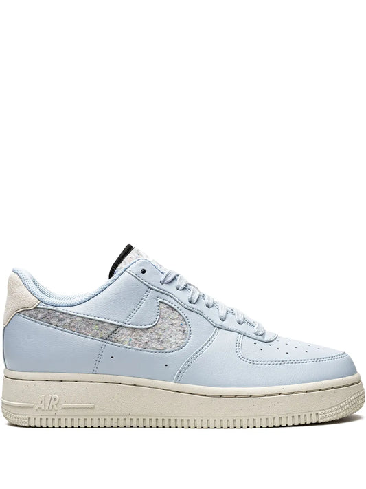 Nike low-top sneaker in light blue with beige suede side, lace-up, cream sole