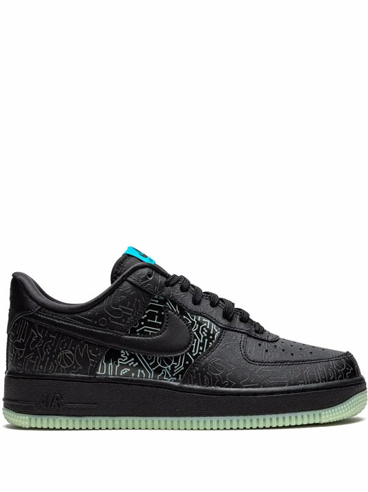 Black low-top Air Force 1 sneakers with black laces, turquoise accents, and green outsole