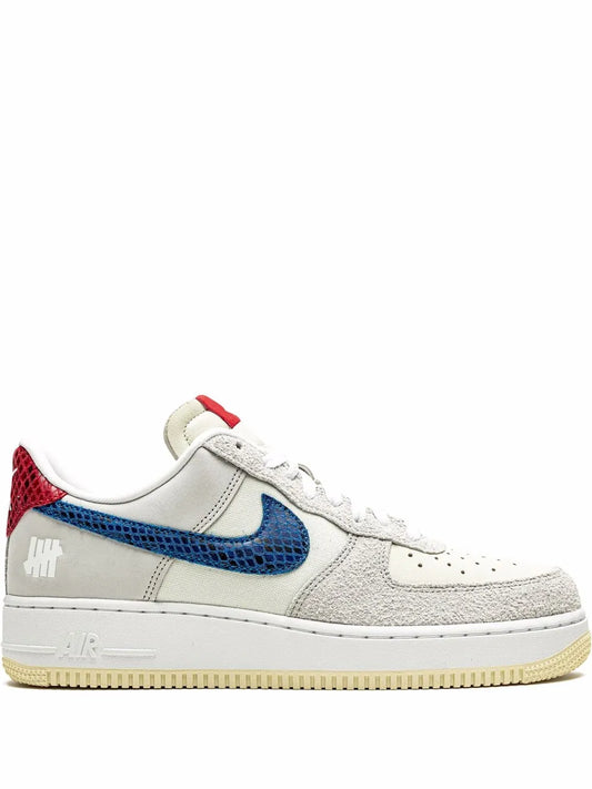 Nike x Undefeated Air Force 1 low sneakers, white with blue swoosh and red heel