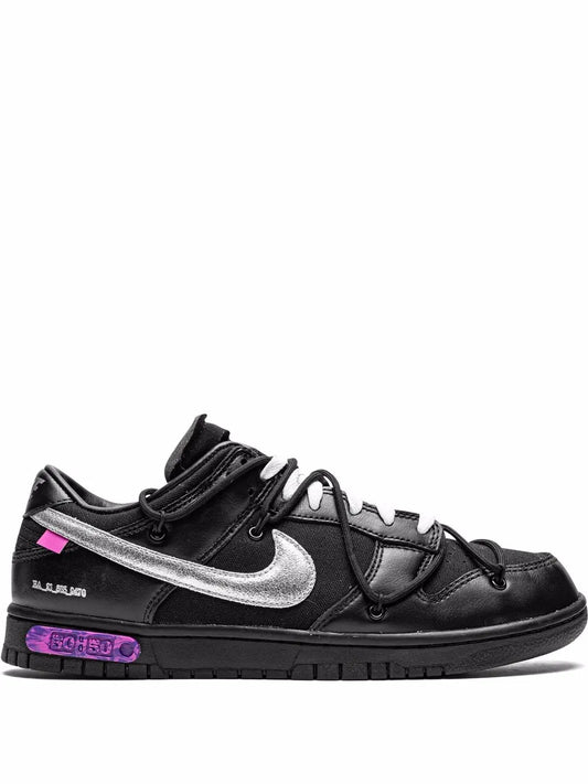 Black Nike Dunk Low sneakers with silver swoosh and purple accent outsole