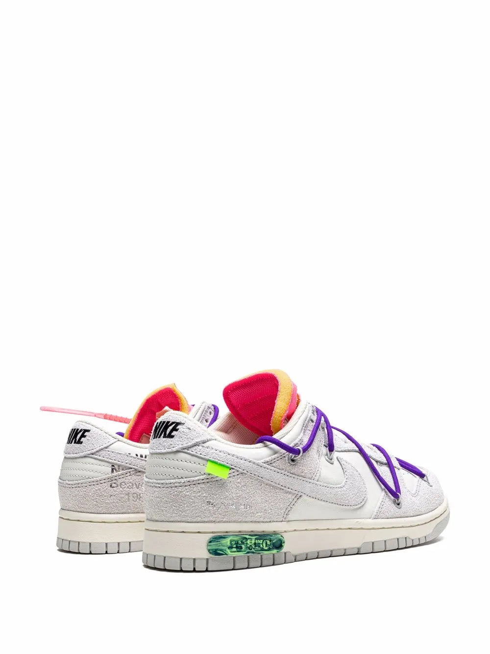 Pair of light gray low-top sneakers with purple laces and red interior lining