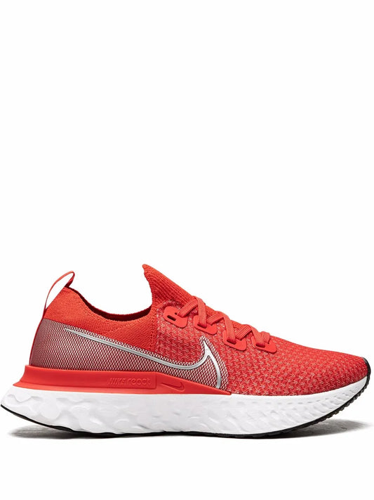 Red Flyknit running shoe with Nike Swoosh, lace-up, and white cushioned sole