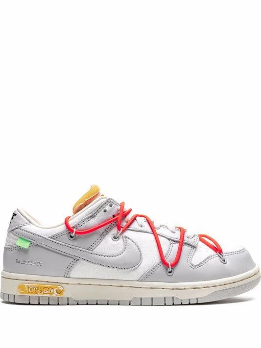 Low-top sneakers in white and gray with red laces and green heel detail