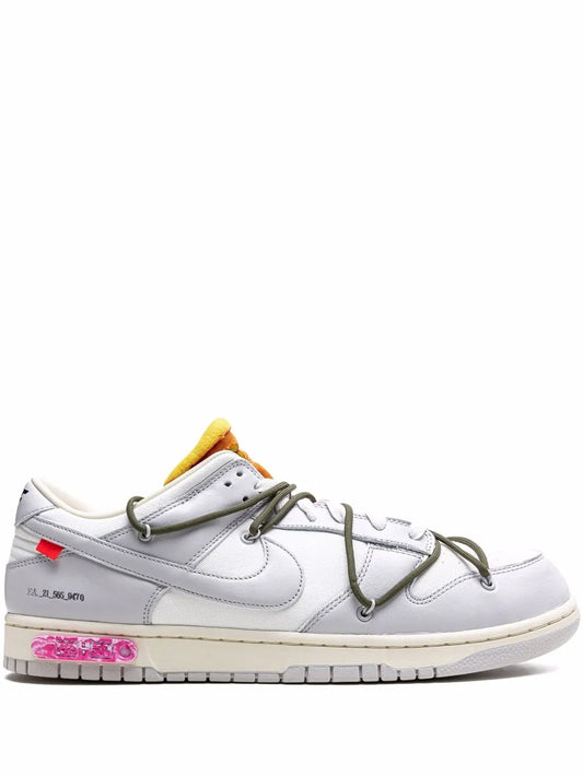 White Dunk Low sneakers with green laces, yellow tongue, pink outsole graphic
