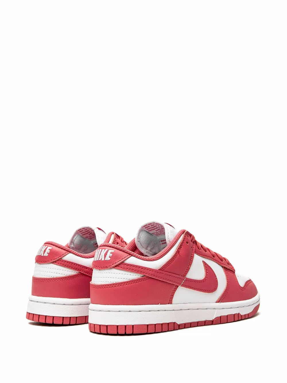 Low-top sneakers pair from heel, red midsoles and white uppers with swoosh