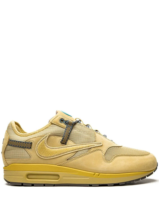 Nike Air Max 1 sneaker in tan with yellow Swoosh and lace-up front
