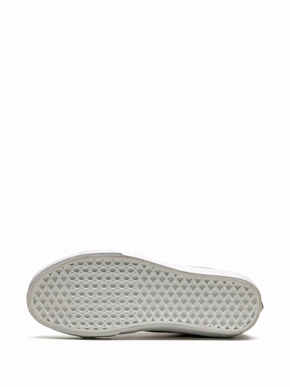 Sneaker outsole with textured tread pattern and white rubber edge
