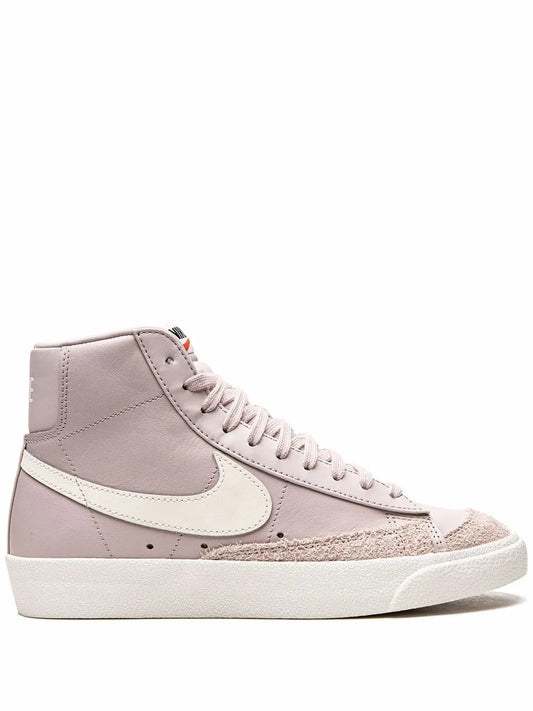 Pink mid-top lace-up sneaker with white Swoosh and off-white rubber sole