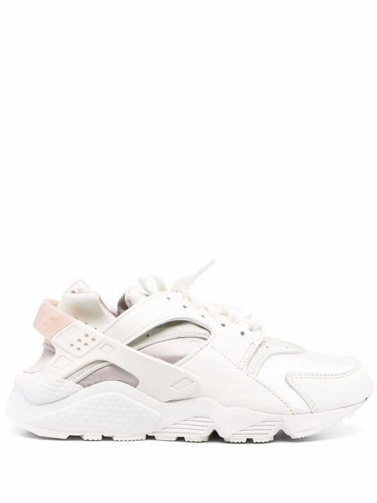 Nike Air Huarache low-top sneaker, white with blush pink accents, lace-up
