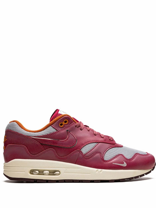 Air Max 1 sneakers in maroon, white and orange; lace-up with visible air unit