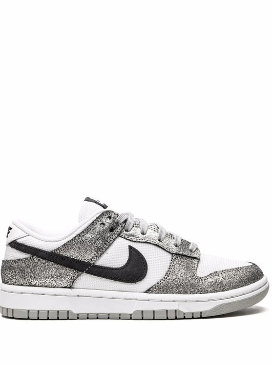 Nike Dunk Low low-top sneaker with black swoosh, white laces, and speckled gray panels