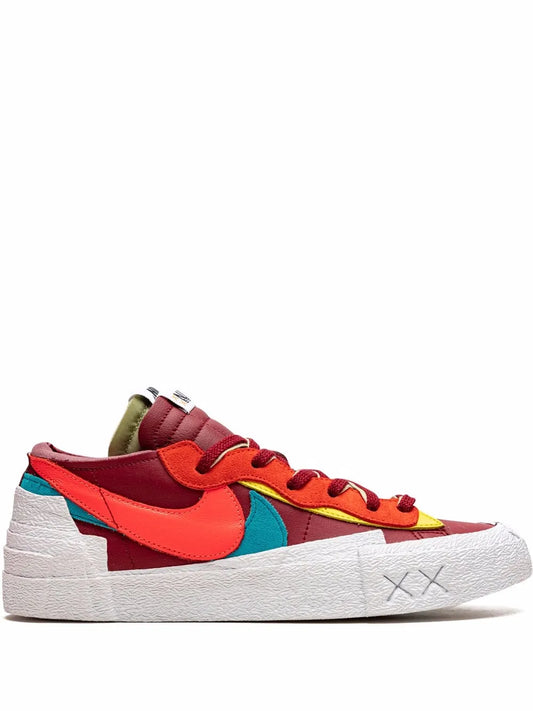 Colorful low-top sneaker with red upper, turquoise and yellow accents, white sole