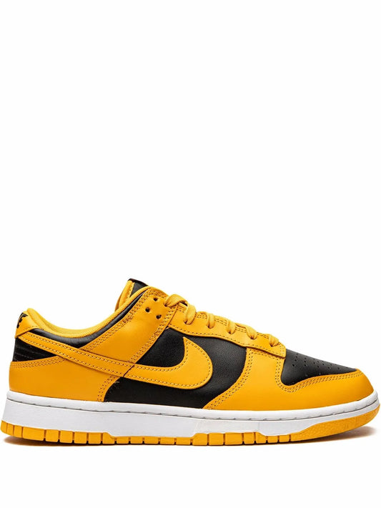 Nike Dunk Low sneakers in yellow and black, low-top with lace-up and white midsole.