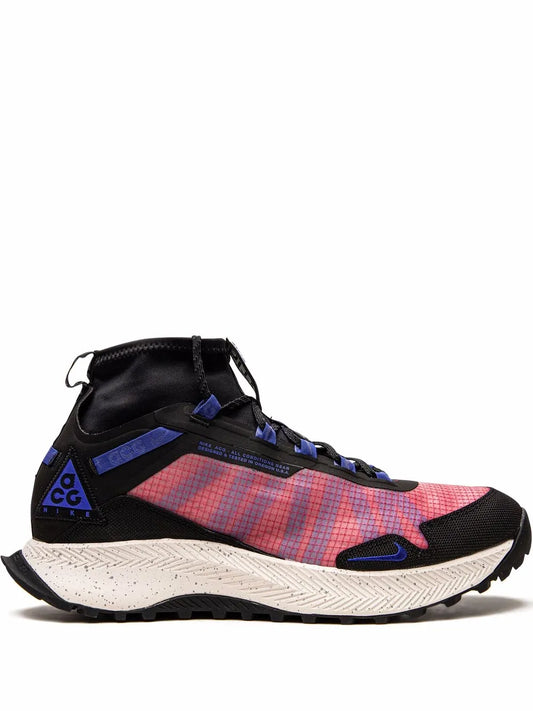Trail sneaker with black upper, red plaid panel, blue accents, and white midsole