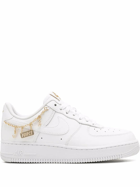 Nike Air Force 1 low-top sneakers in white with gold chain and tag detail