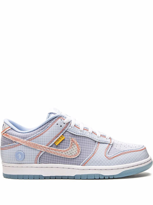 Nike Dunk Low lace-up sneaker in light blue/gray with orange swoosh detail