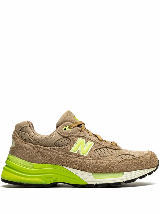 Beige low-top sneaker with neon green N logo and lime midsole