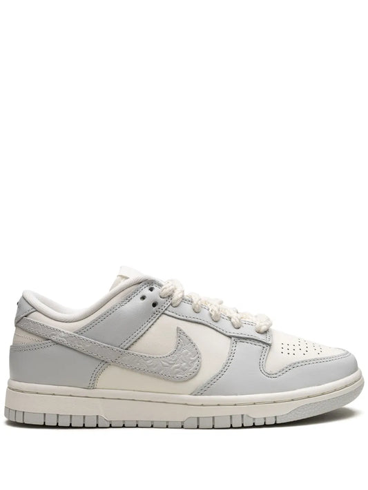 Nike Dunk Low low-top sneakers in white and light gray with lace-up and Swoosh